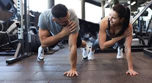 Toning Bingo Wings: Your Ultimate Guide to Sculpting Sleek Arms at the Gym 3 Fitness trainer demonstrating arm toning exercises Nuneaton